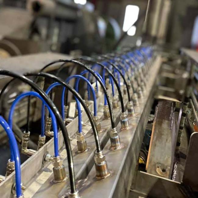 view of a lubrication plant for metal parts in contact with material being processed
